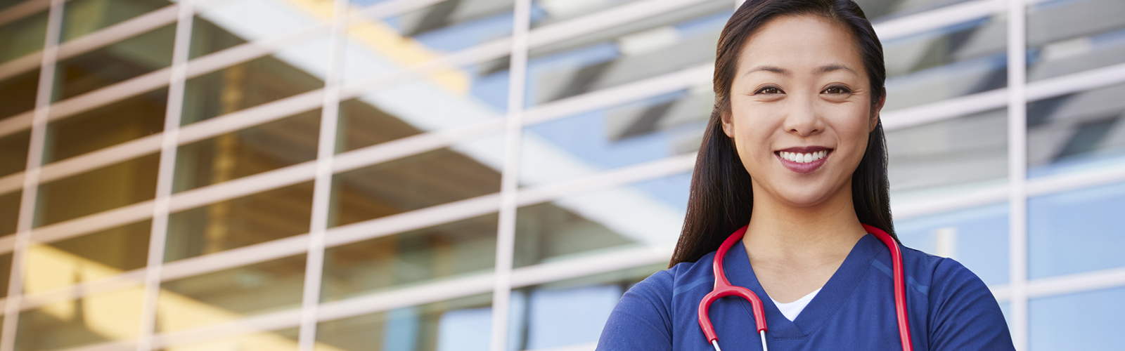 Female doctor in front of hospital