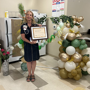 Dr. Stookey receives her certificate