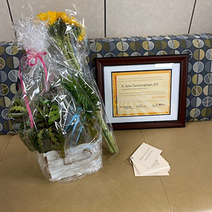 Dr. Cunningham's flowers and award certificate