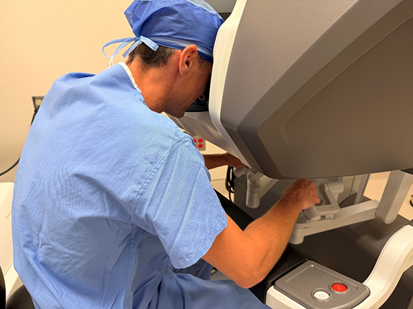 Dr. Joshua Manghelli, Community Health Network Breast Surgeon training with da Vinci Single Port System