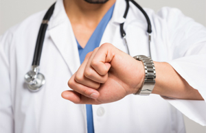 Physician looking at watch