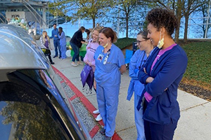 NICU caregivers greeting at drive-thru adventure