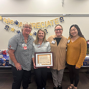 Lori Vasquez receiving award