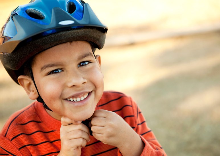 Boy wearing bicycle helmet