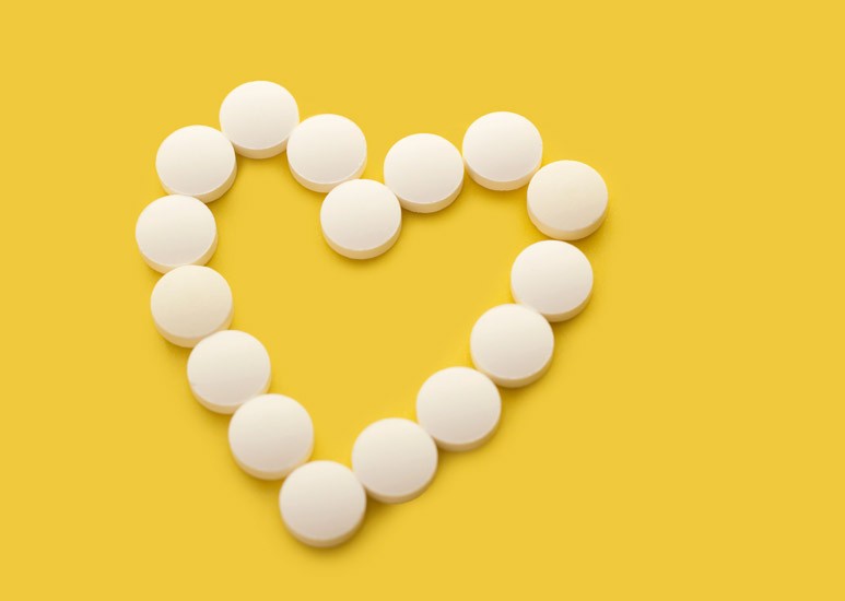 Aspirin in the shape of a heart
