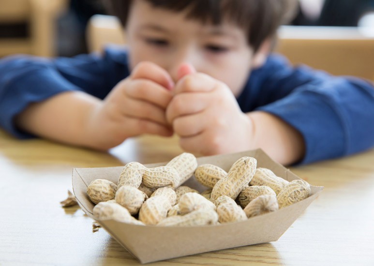 Kid eating peanuts at school