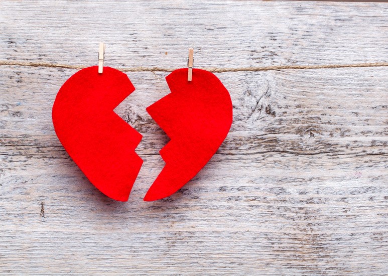 Felt "broken" red heart clothespinned to a line