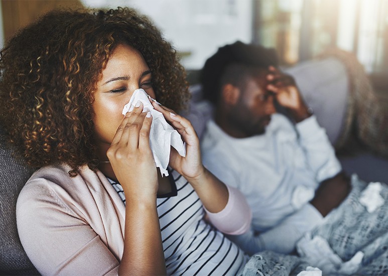 Woman and man sick with flu