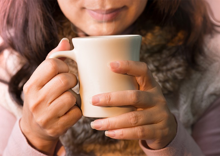 Woman holding a mug