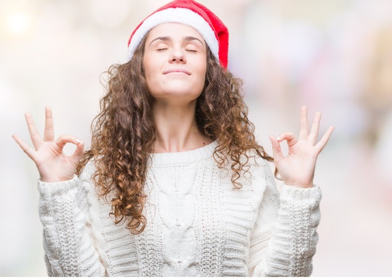 Woman wearing Santa hat destressing