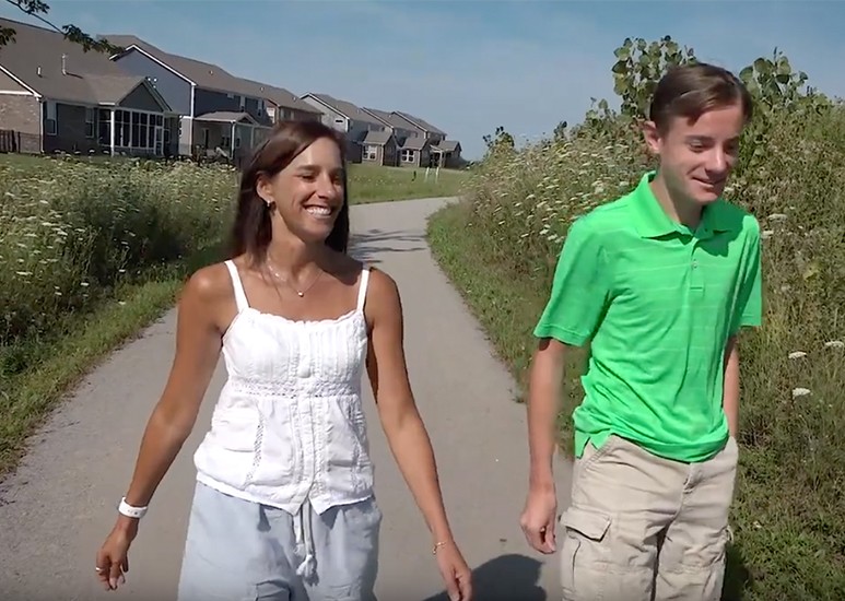 Jennifer walking with son after Addison's Disease treatment