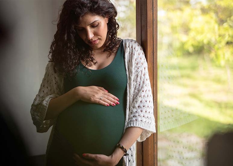 pregnant woman by window