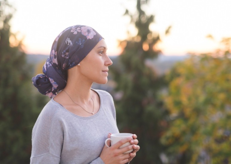 cancer patient drinking coffee outside