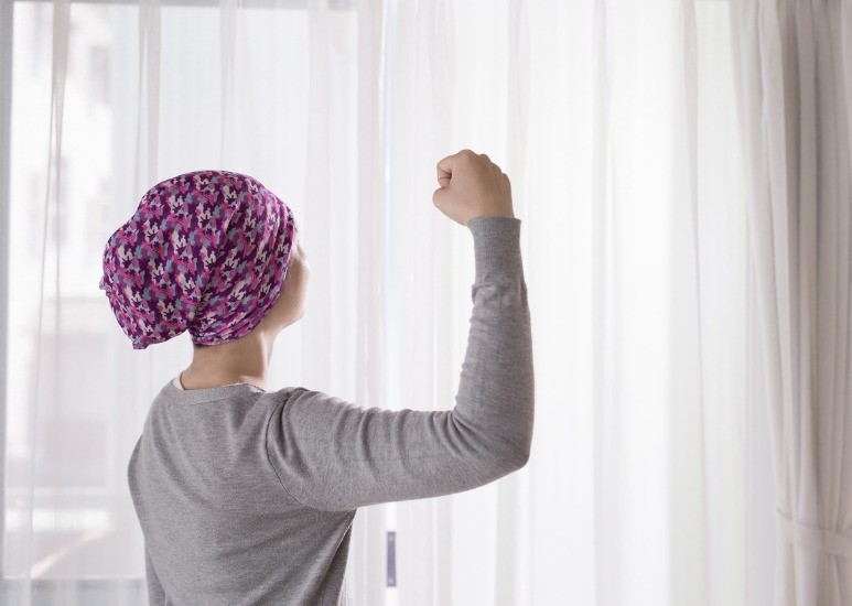cancer survivor facing window 