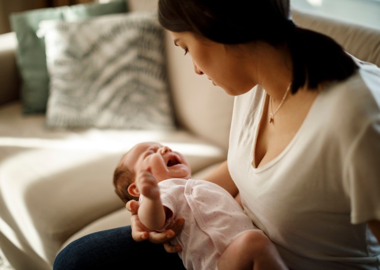 mom with crying newborn