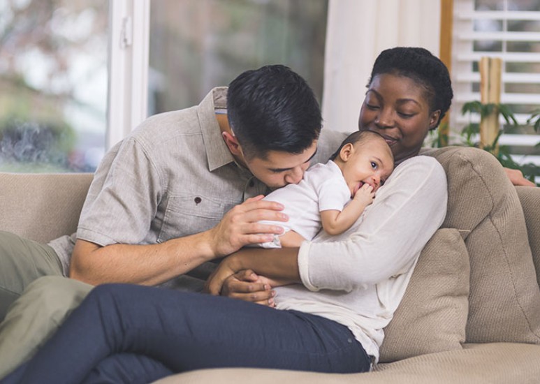 couple with newborn at home