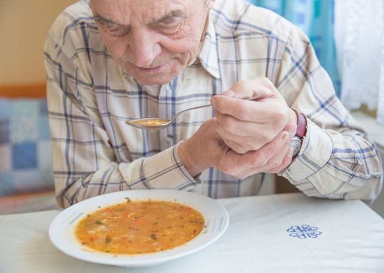man with hand tremor 