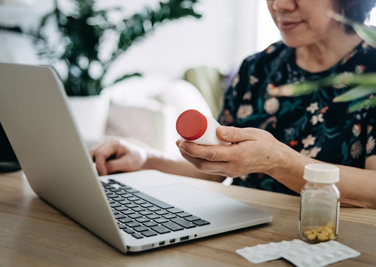 woman looking at cost of medical coverage with medicare 