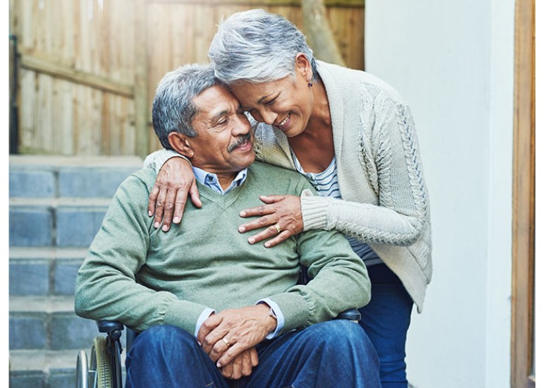 Couple hugging outside 