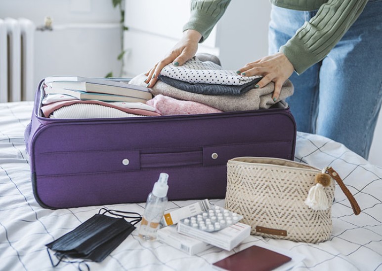 Woman packing for international travel