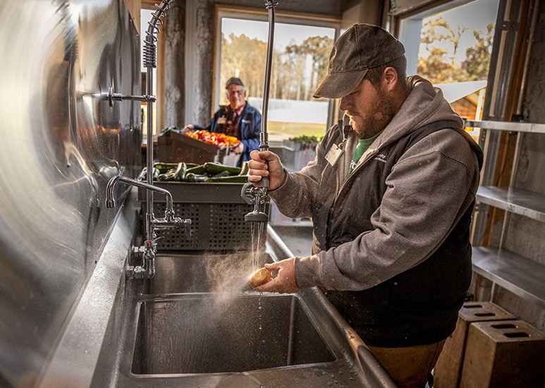 Mikkal, farmer at Community Farm in Anderson