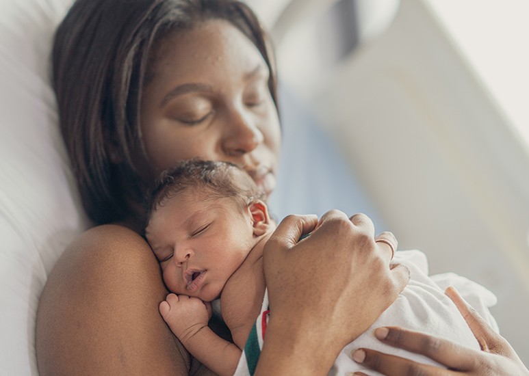 Mom holding newborn baby