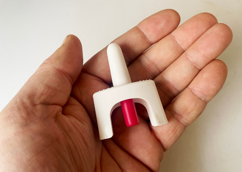 Hand holding Naloxene inhaler