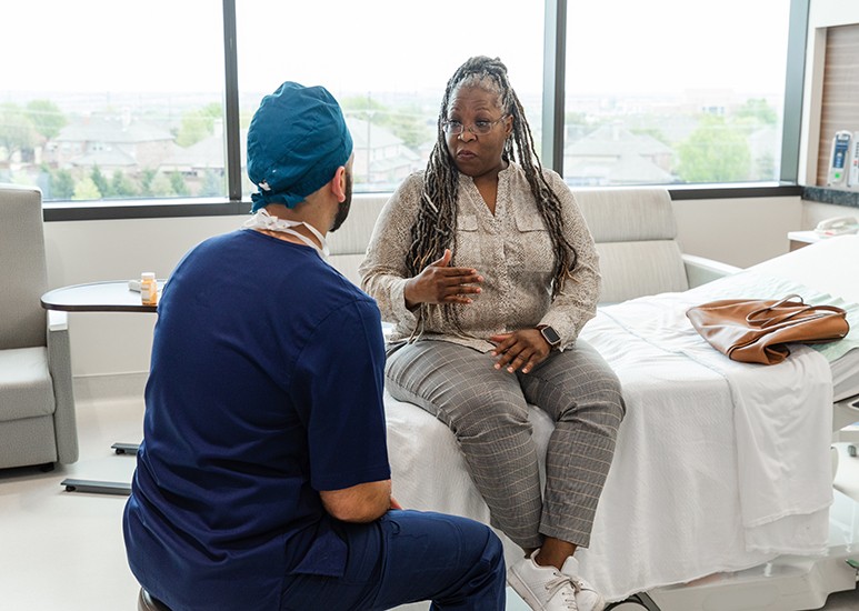 Hernia repair patient discussing with surgeon