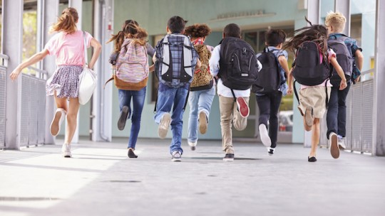 Children wearing backpacks