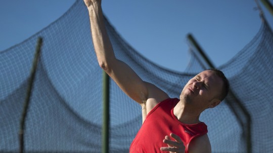 Athlete throwing shotput