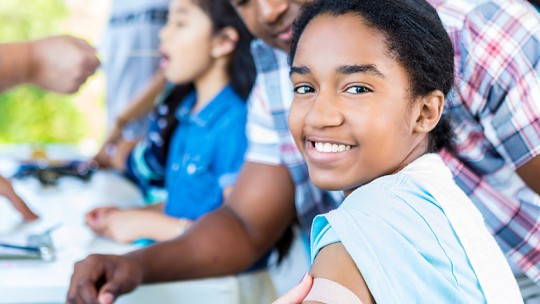 Girl smiling after flu shot