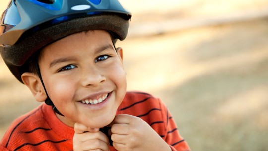 Boy wearing bicycle helmet