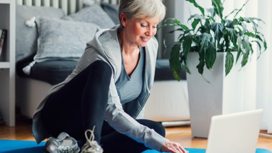 Senior woman exercising at home