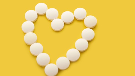 Aspirin in the shape of a heart