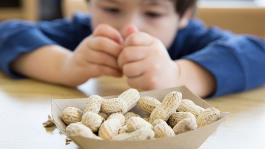 Kid eating peanuts at school