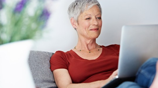 Senior woman using laptop