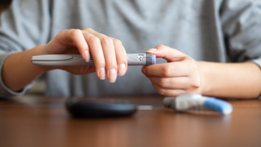 Person checking glucose level