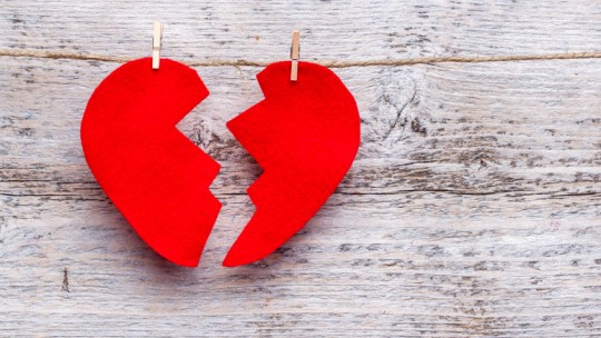Felt "broken" red heart clothespinned to a line