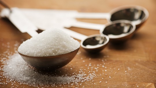 measuring spoon full of sugar