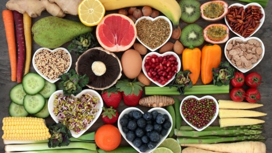 healthy food on table in heart shaped containers