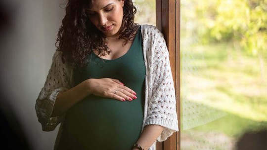 pregnant woman by window