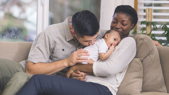couple with newborn at home