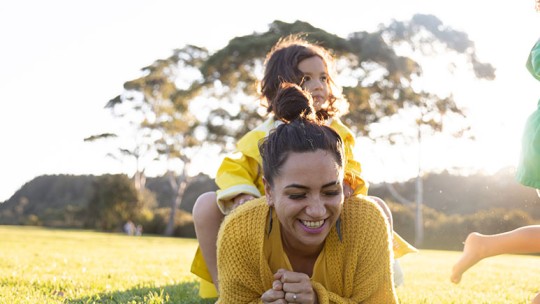 women enjoying sun with family