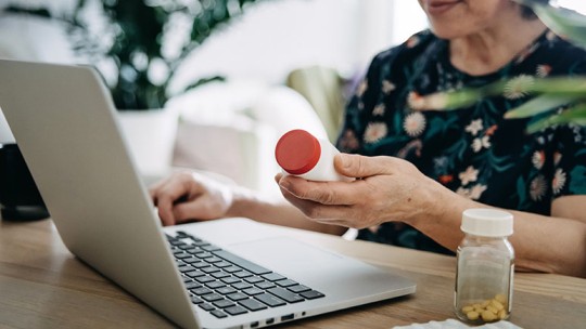 woman looking at cost of medical coverage with medicare 