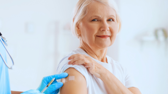 Older woman getting a vaccination 