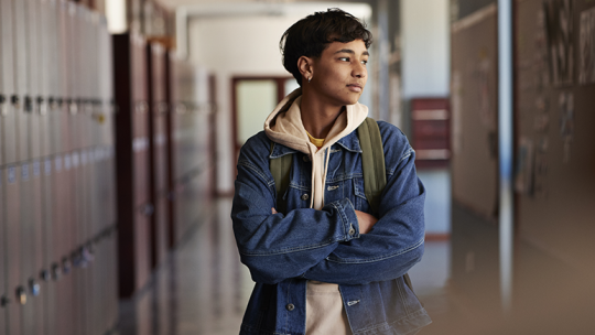 Teen in School Hallway