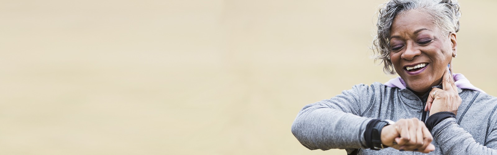 African-American woman in her 50s checking her heart rate