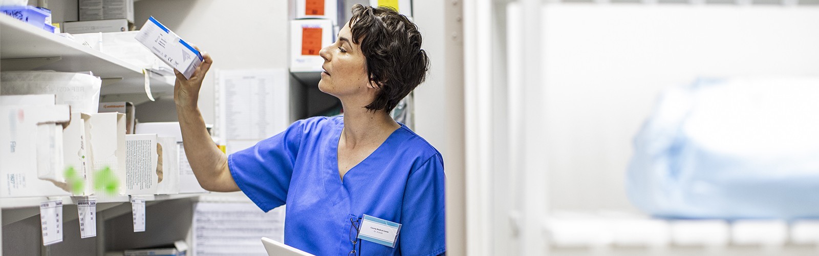 Patient care tech getting medical supplies