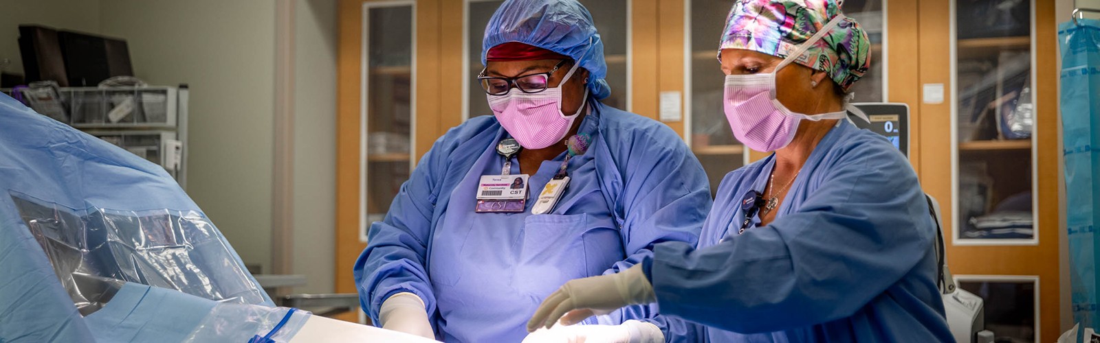 Certified surgical technologists prepping the OR