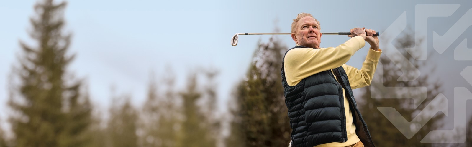 Healthy man practicing golf swing